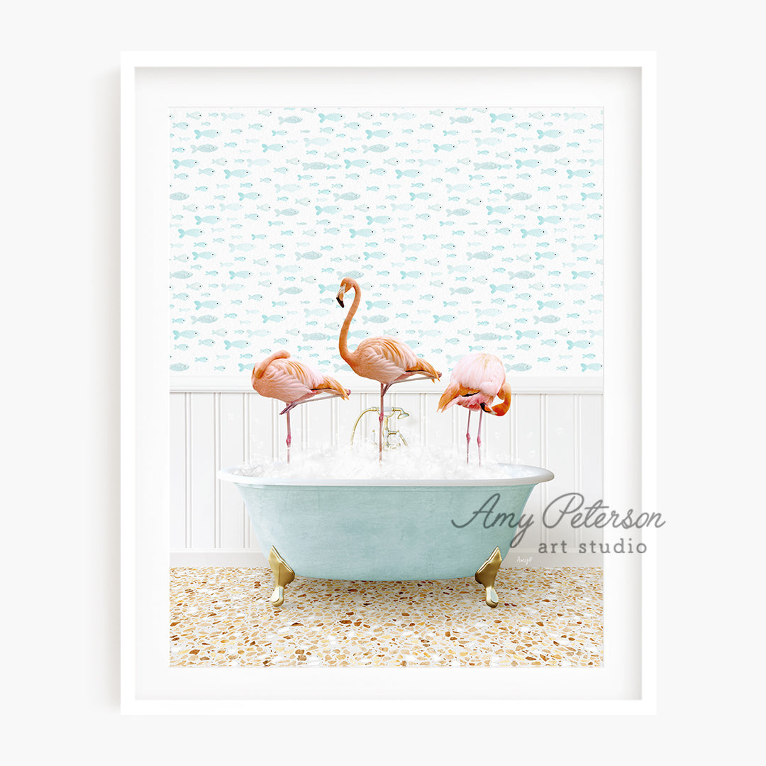 three flamingos in a bathtub with ice