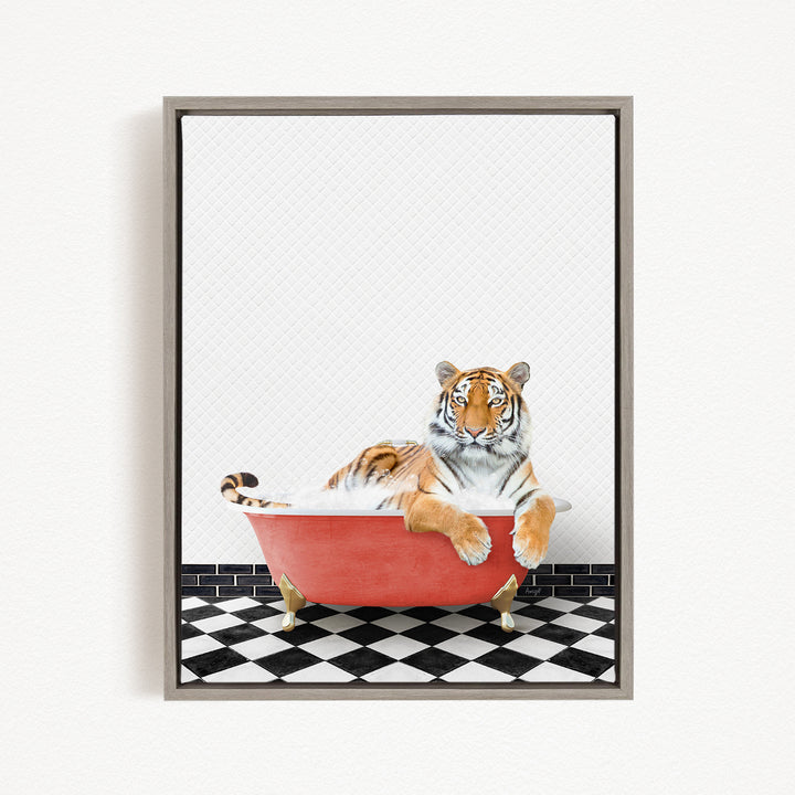 A tiger is sitting in a red bathtub, surrounded by a black and white checkered floor.