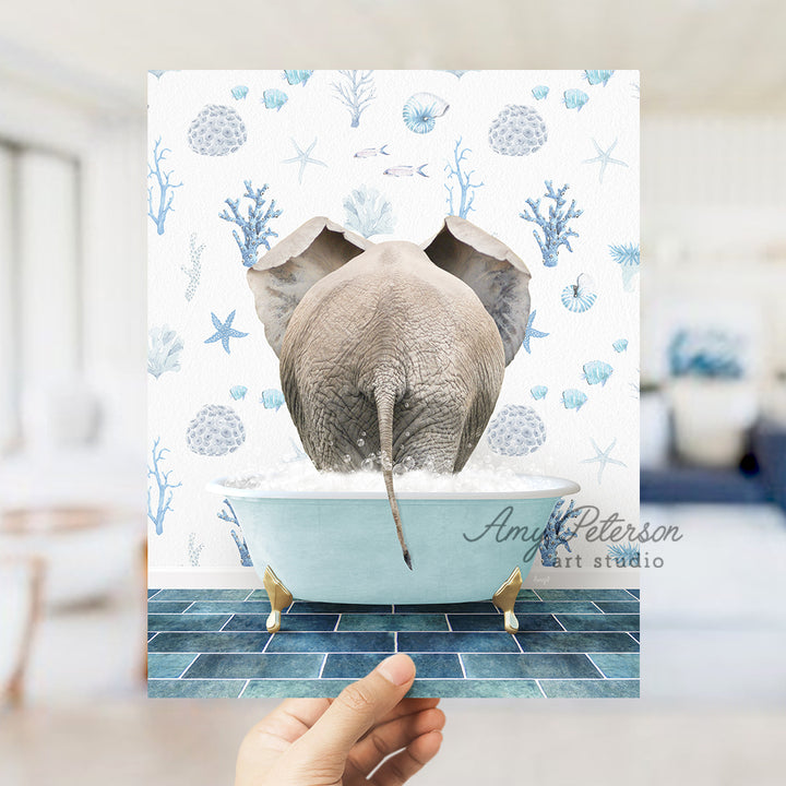 a person holding up a card with an elephant in a bathtub