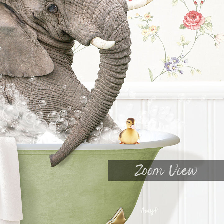 An elephant is taking a bath in a green tub, with a small yellow duck sitting on the edge of the tub.