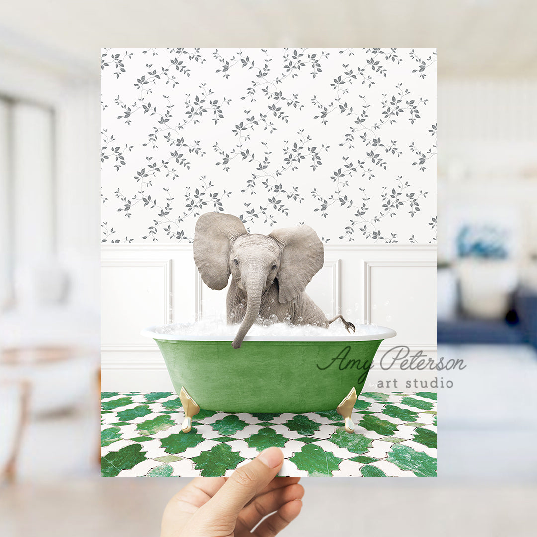 a person holding up a card with an elephant in a bathtub