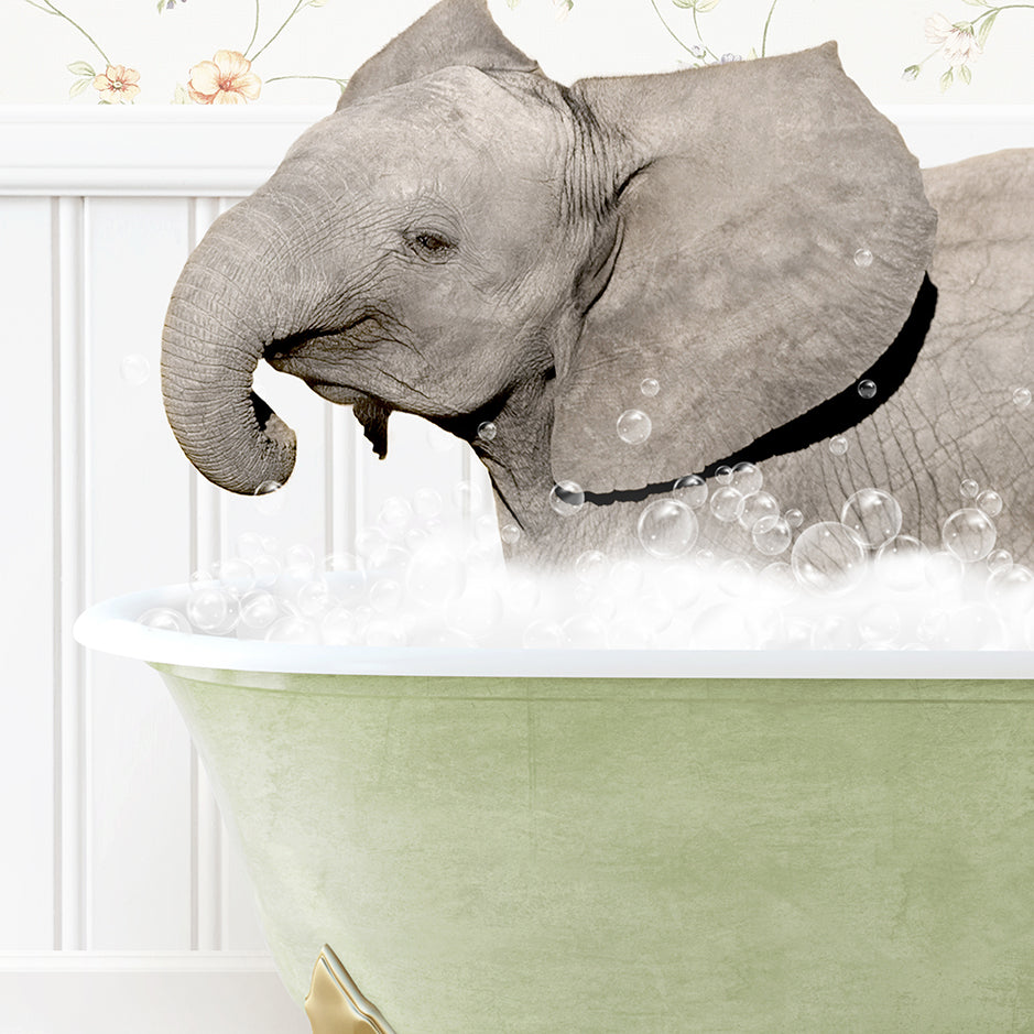 a baby elephant taking a bath in a bathtub