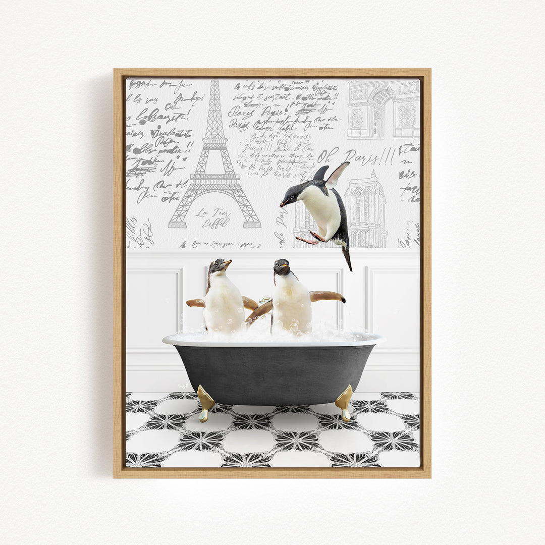 A framed image depicting two penguins sitting in a bathtub, with one penguin flying towards the other. The background features the Eiffel Tower and other architectural elements.