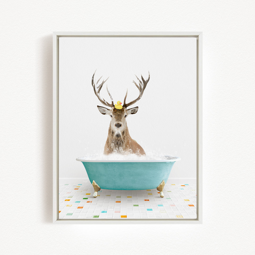 A deer with antlers is sitting in a blue bathtub, with a rubber duck perched on its head.