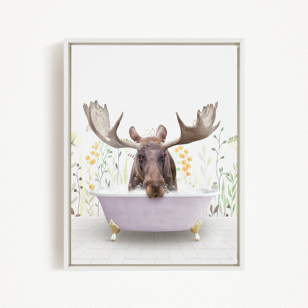 A moose with large antlers is sitting in a bathtub filled with water, surrounded by flowers and plants.