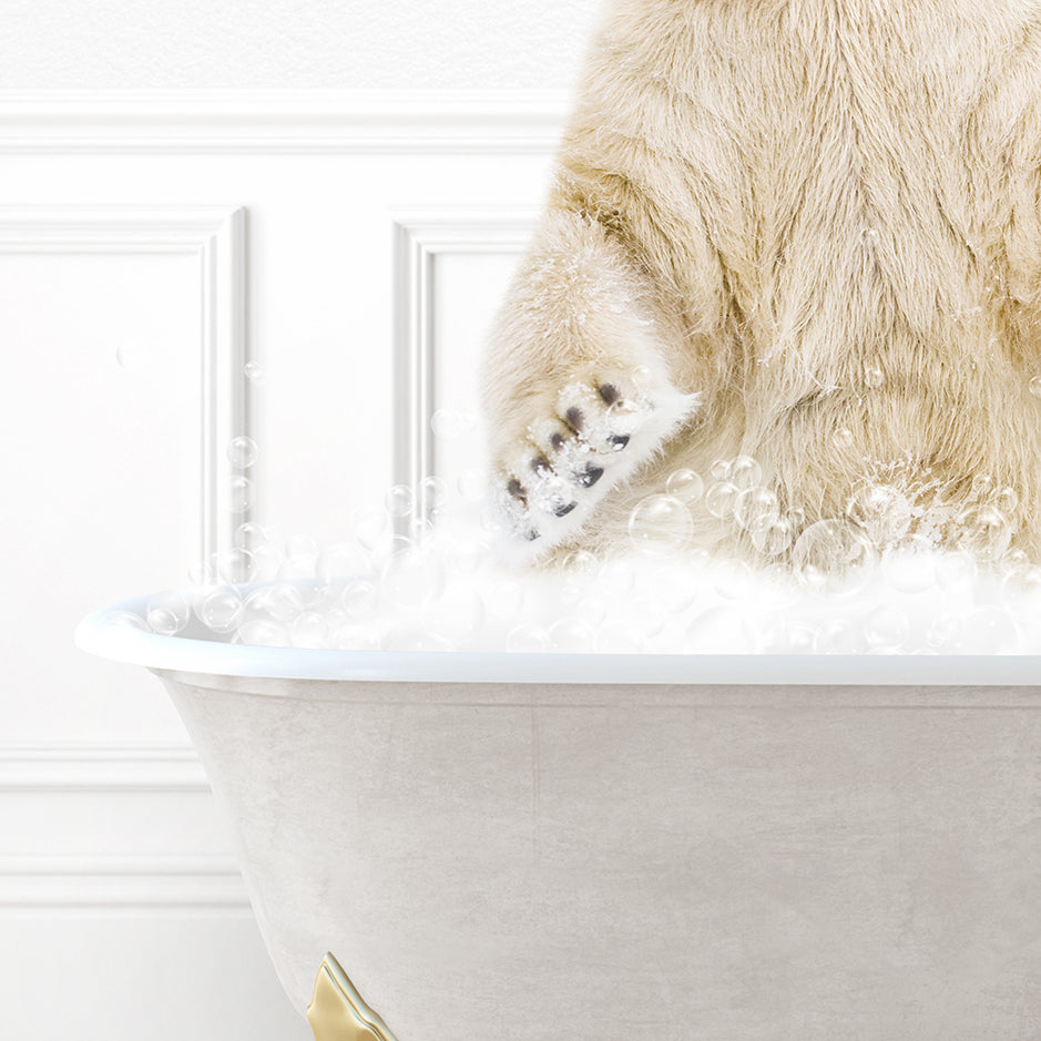 a polar bear sitting in a bathtub full of foam