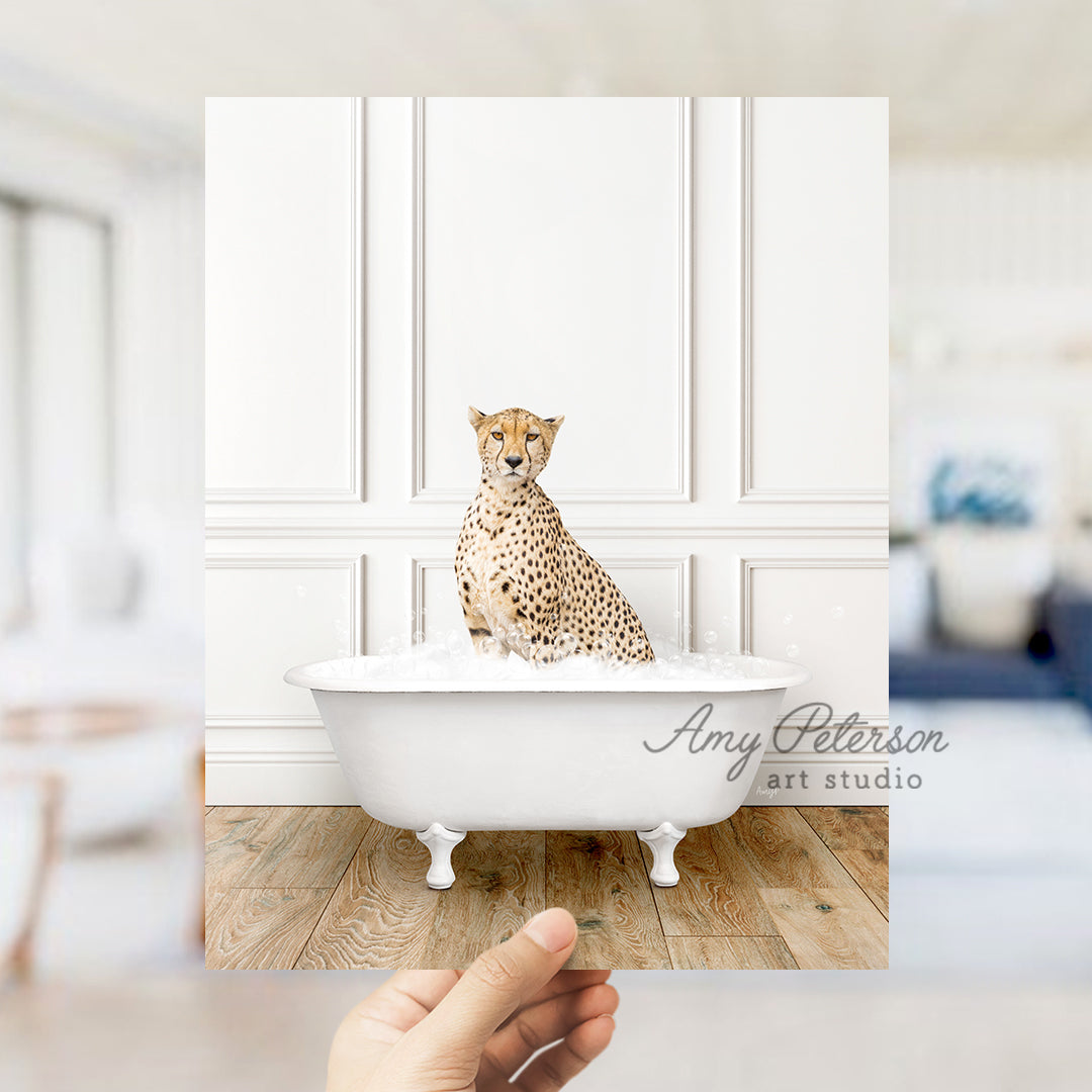 a hand holding a photo of a cheetah sitting in a bathtub