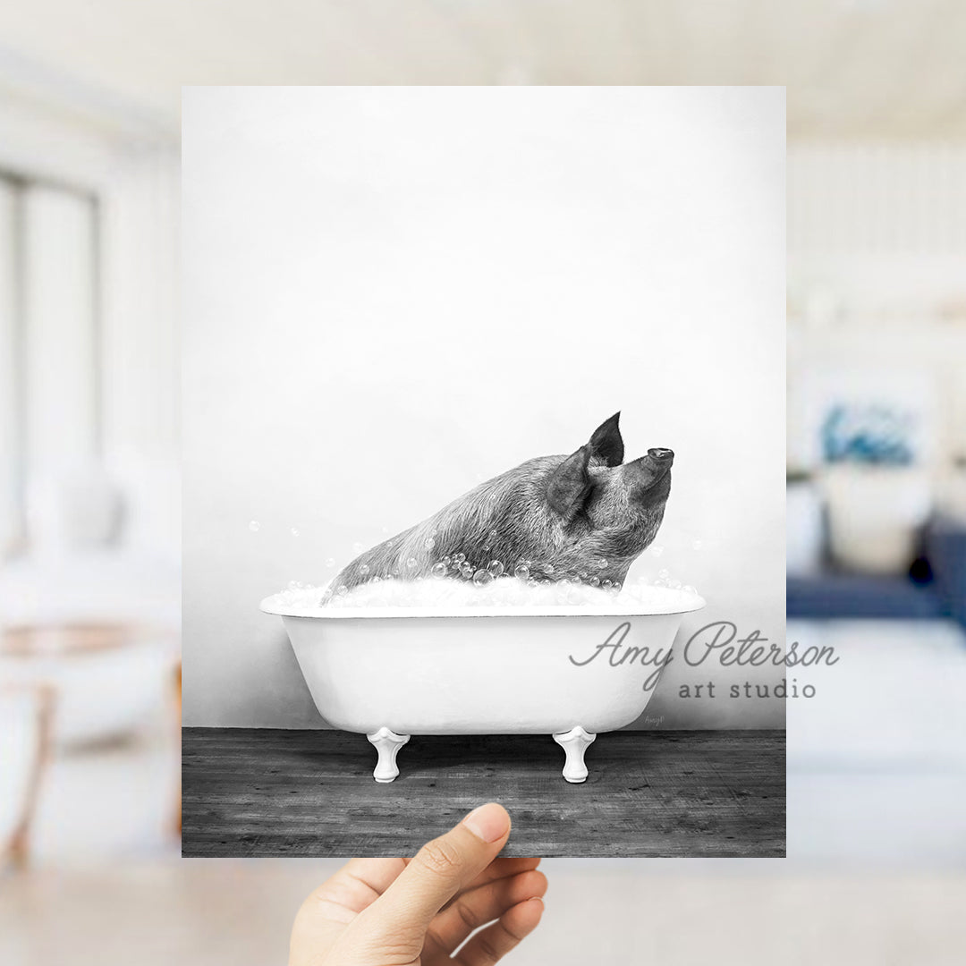 a black and white photo of a dog in a bathtub