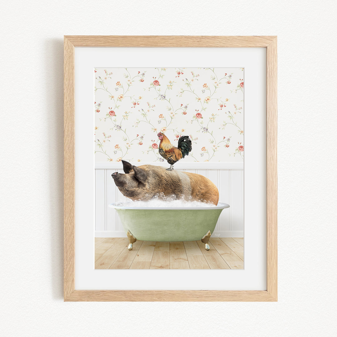 A framed image depicting a pig sitting in a green bathtub, with a rooster perched on its back.