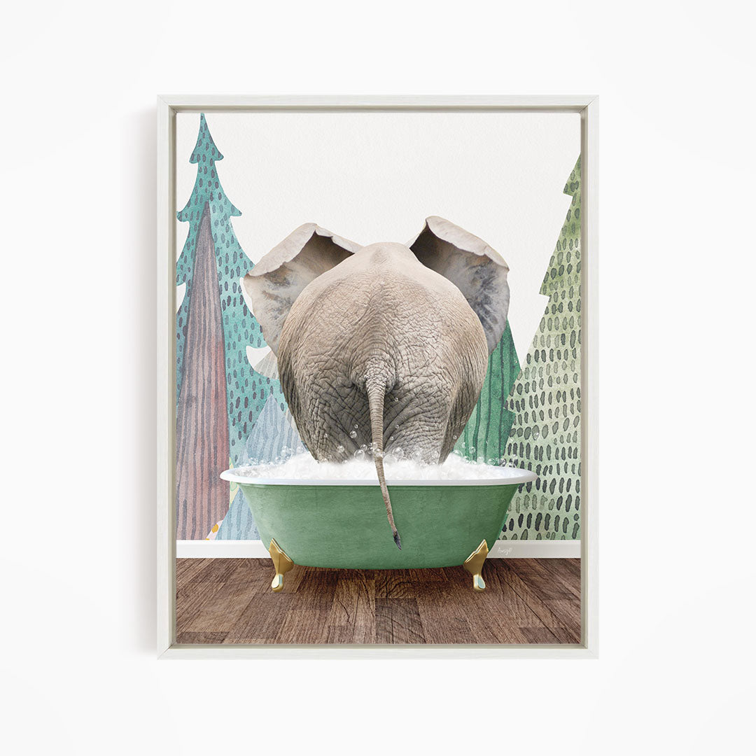 An elephant is taking a bath in a green tub, surrounded by trees and a snowy landscape.