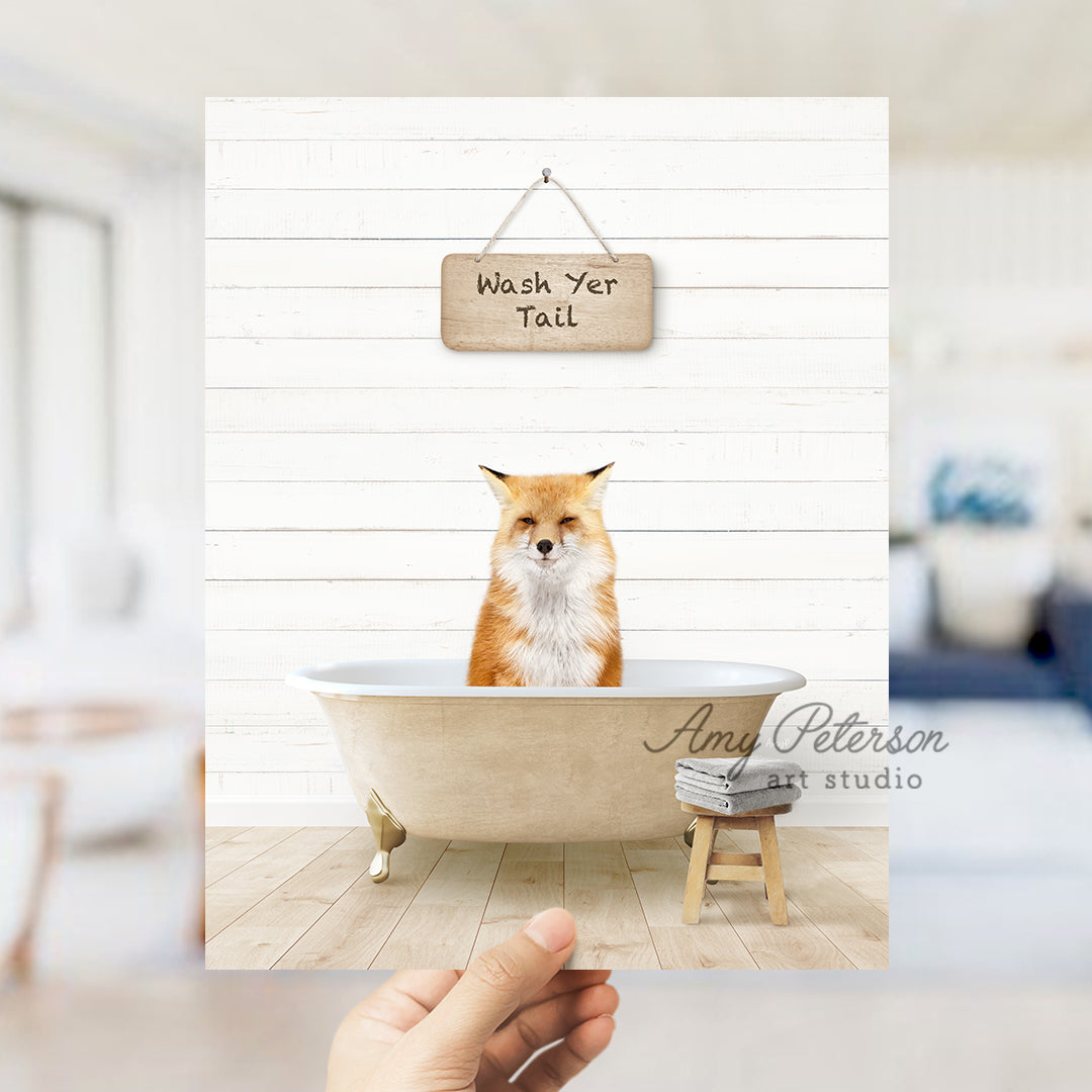 a hand holding up a card with a picture of a fox in a bathtub