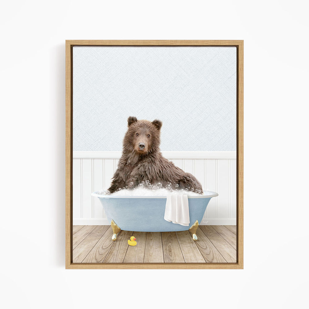 A brown bear sitting in a blue bathtub filled with water, surrounded by rubber ducks.