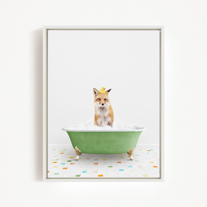 A fox is sitting in a green bathtub filled with bubbles, wearing a yellow rubber duck hat.