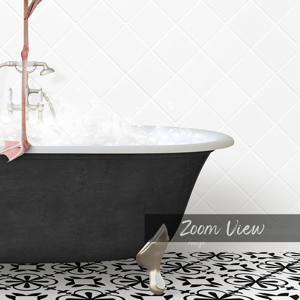 a black claw-foot bathtub filled with water, with a white tiled wall in the background.