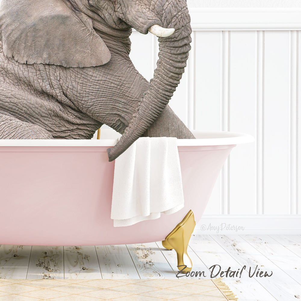 A large gray elephant is sitting in a pink bathtub, with a white towel and gold bathtub leg visible.