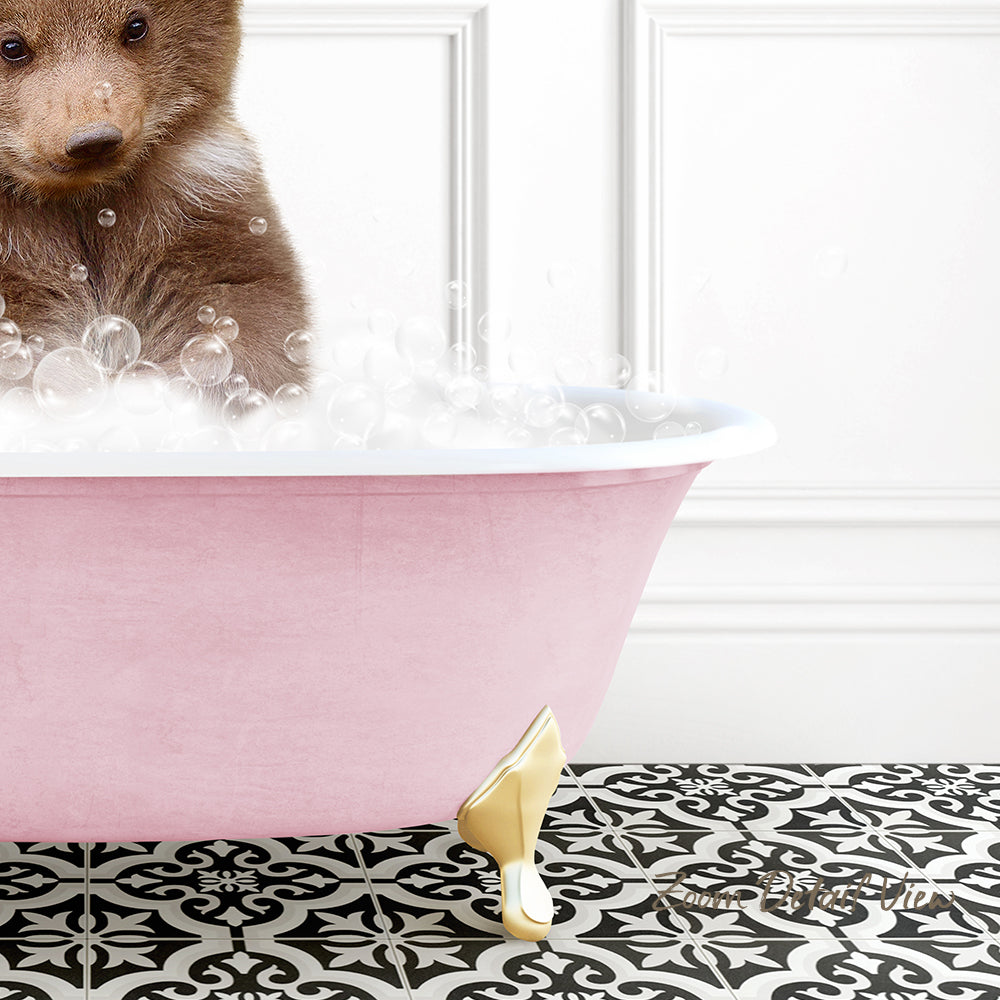 A brown bear is sitting in a pink bathtub filled with bubbles, creating a whimsical and playful scene.