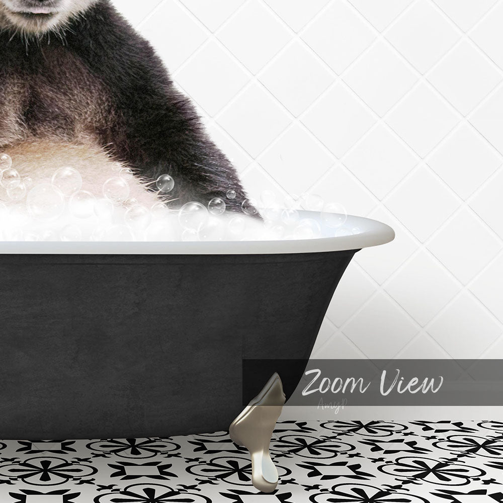 A black bathtub filled with bubbles, with a cat sitting inside and enjoying the bath.