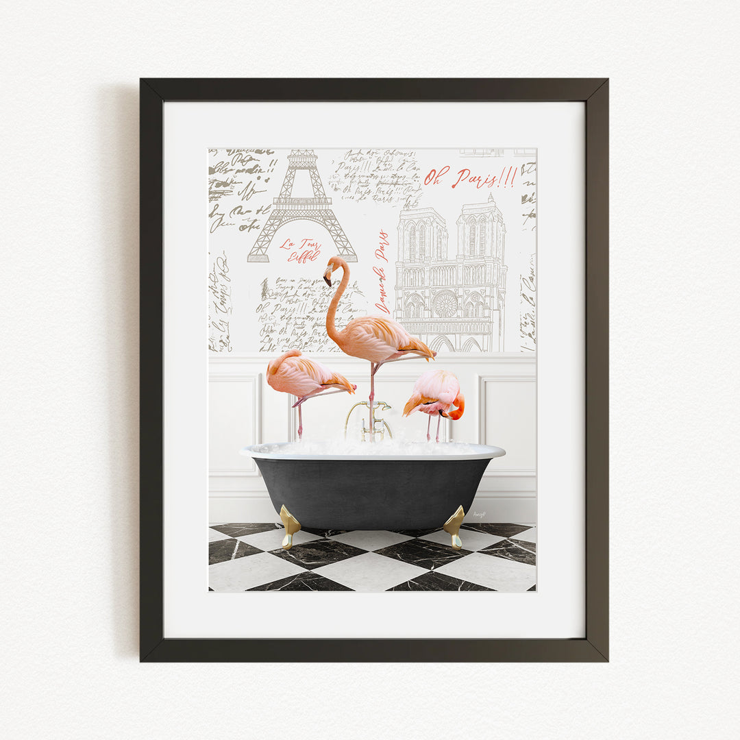 A framed image depicting three flamingos standing in a bathtub, with a black and white checkered floor and a drawing of the Eiffel Tower in the background.