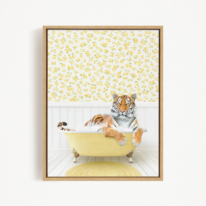 A tiger is sitting in a yellow bathtub, surrounded by a yellow and white floral pattern on the wall behind it.