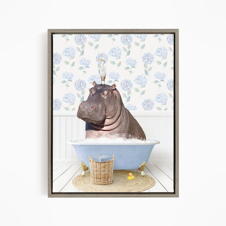 A hippopotamus sitting in a bathtub filled with water, surrounded by a basket of rubber ducks and a bird perched on its head.