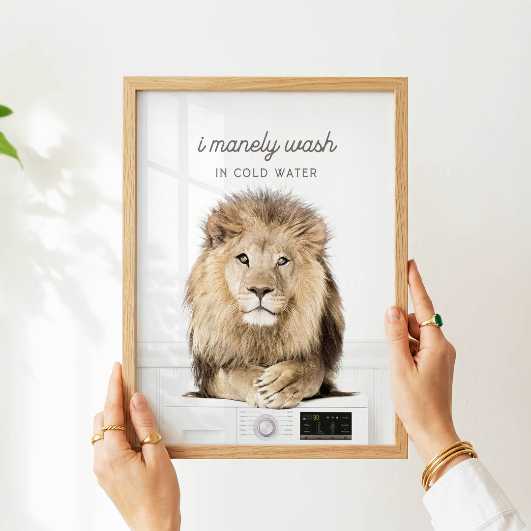 A person is holding up a framed image of a lion, which appears to be a creative or artistic representation of the phrase "I merely wash in cold water".