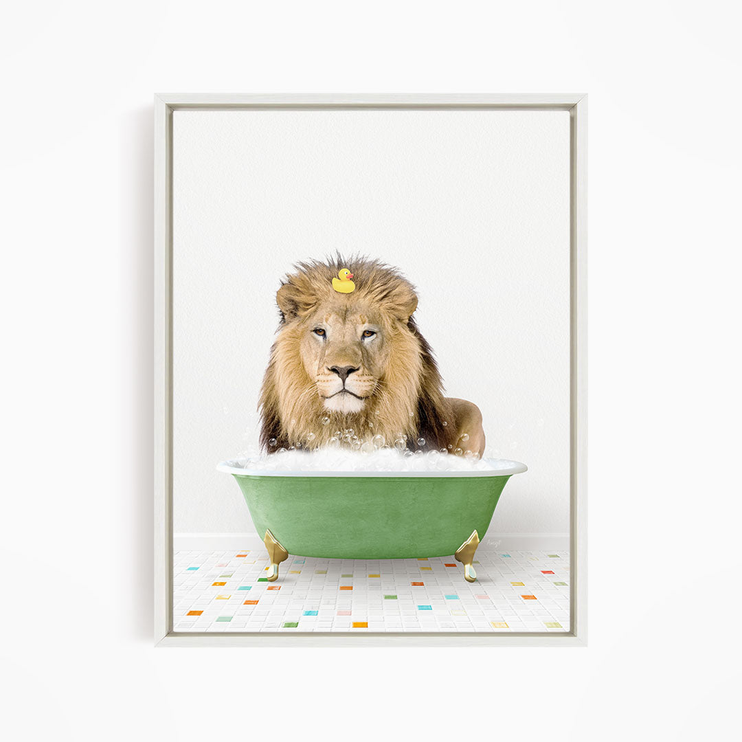 A lion is sitting in a green bathtub filled with bubbles, with a rubber duck floating on top.