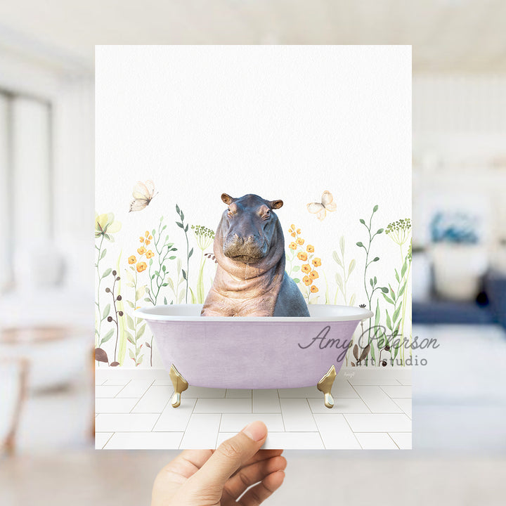 a hippo sitting in a bathtub with flowers around it