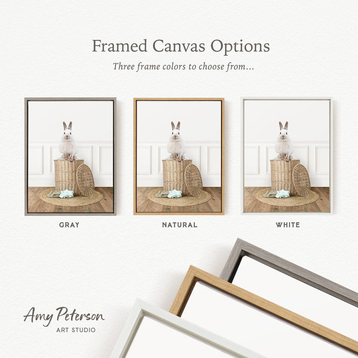 three framed canvas options, each featuring a white rabbit sitting on a basket. The options include a gray frame, a natural frame, and a white frame.