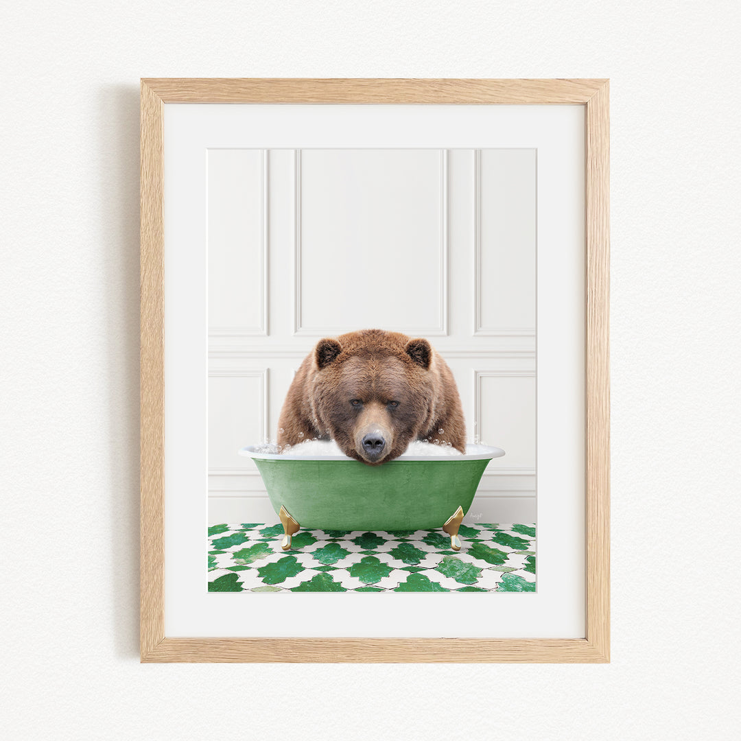 A brown bear is sitting in a green bathtub, appearing to be enjoying a relaxing bath.