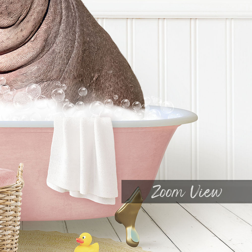 A pink bathtub filled with bubbles, with a white towel and a yellow rubber duck inside.