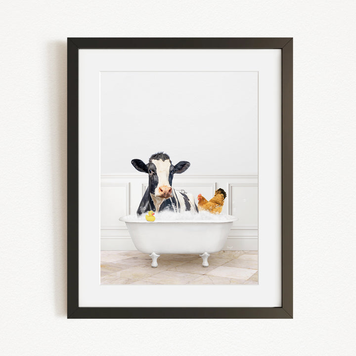 A black and white cow is sitting in a white bathtub, surrounded by a yellow rubber duck and a brown chicken, creating a whimsical and playful scene.