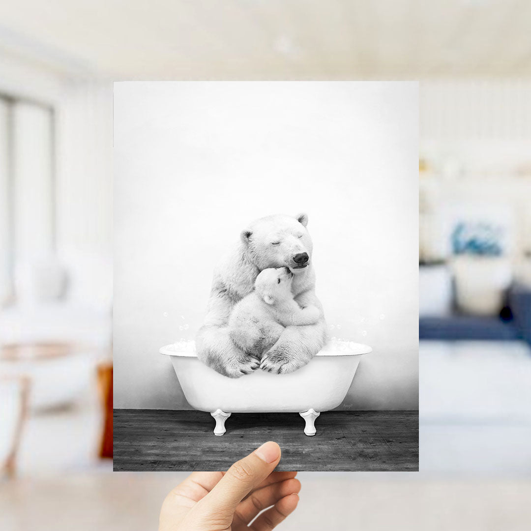 A polar bear and its cub sitting together in a bathtub, with the polar bear appearing to be hugging the cub.