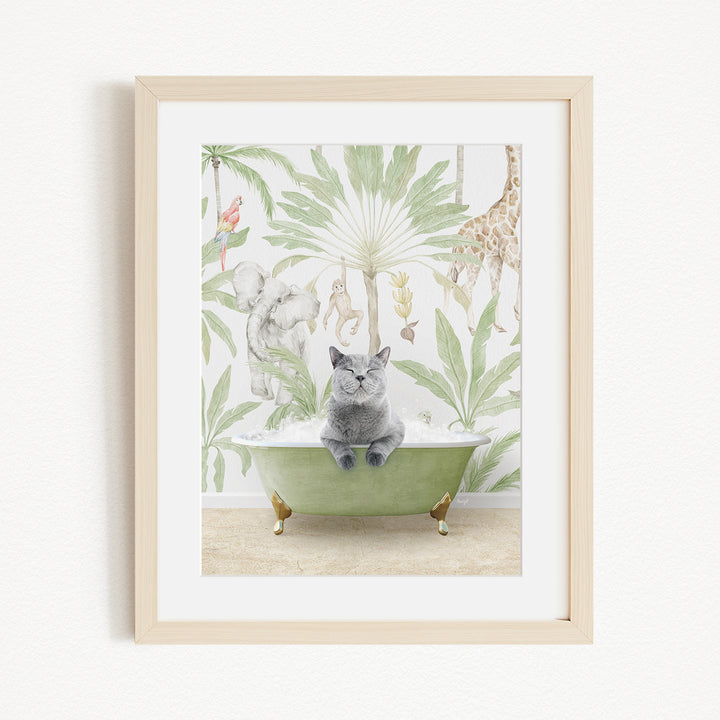 A framed print depicting a gray cat sitting in a green bathtub, surrounded by a tropical jungle scene with various animals and plants.