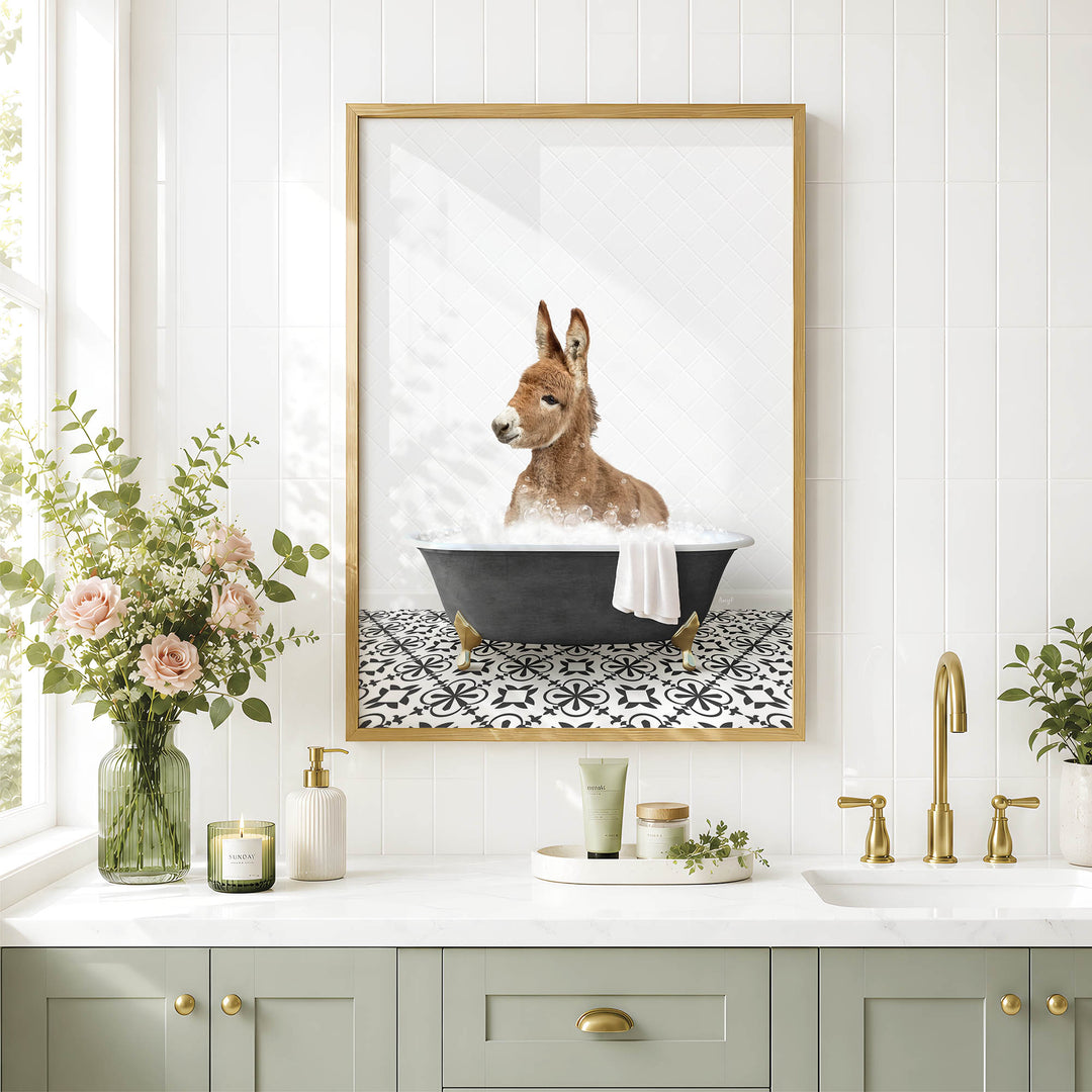 A framed image of a kangaroo sitting in a bathtub, surrounded by flowers and a decorative vase, is displayed on a white tiled wall above a bathroom sink.