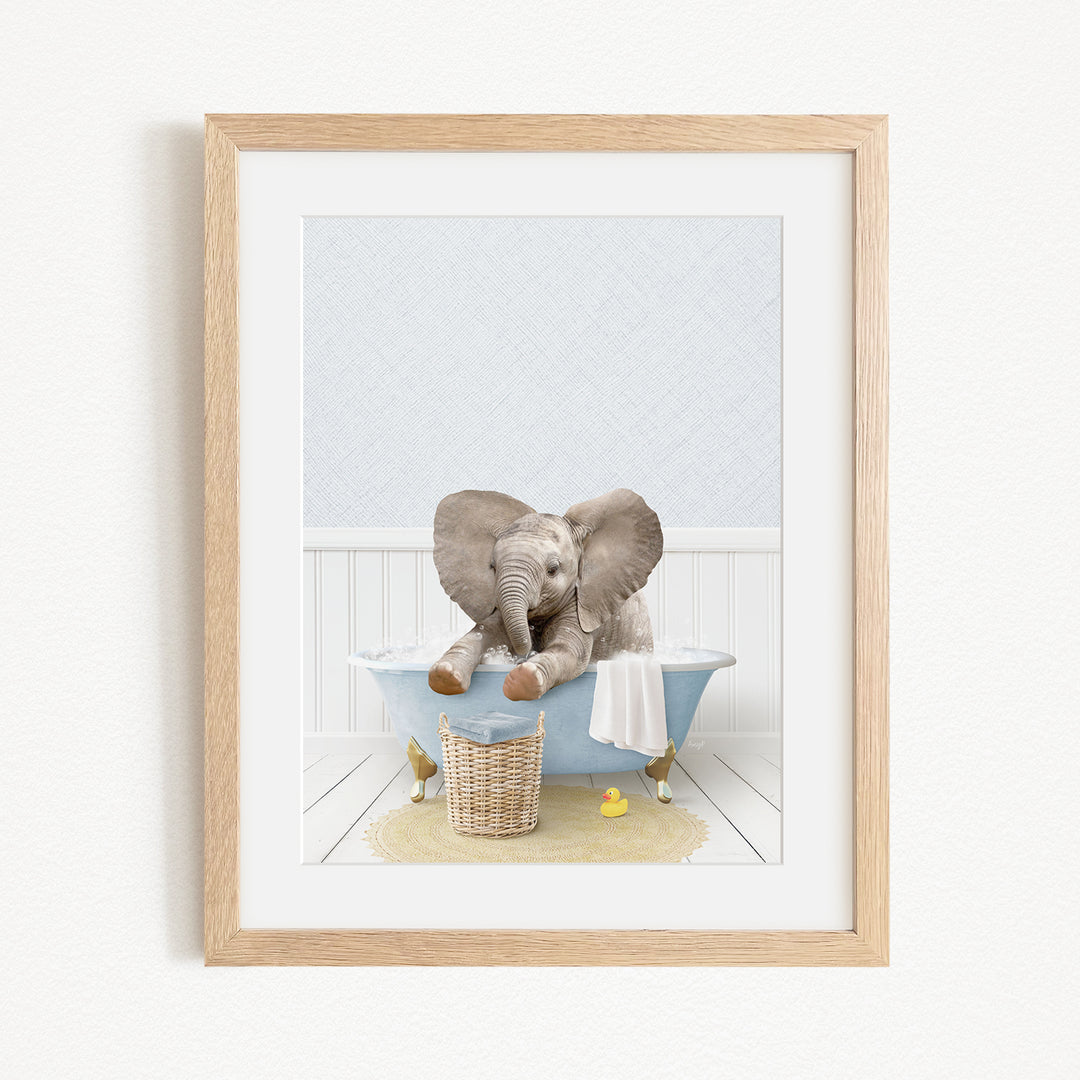 A baby elephant sitting in a blue bathtub, surrounded by rubber ducks.