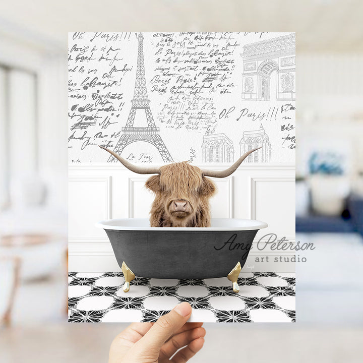 a person holding up a card with a picture of a cow in a bathtub