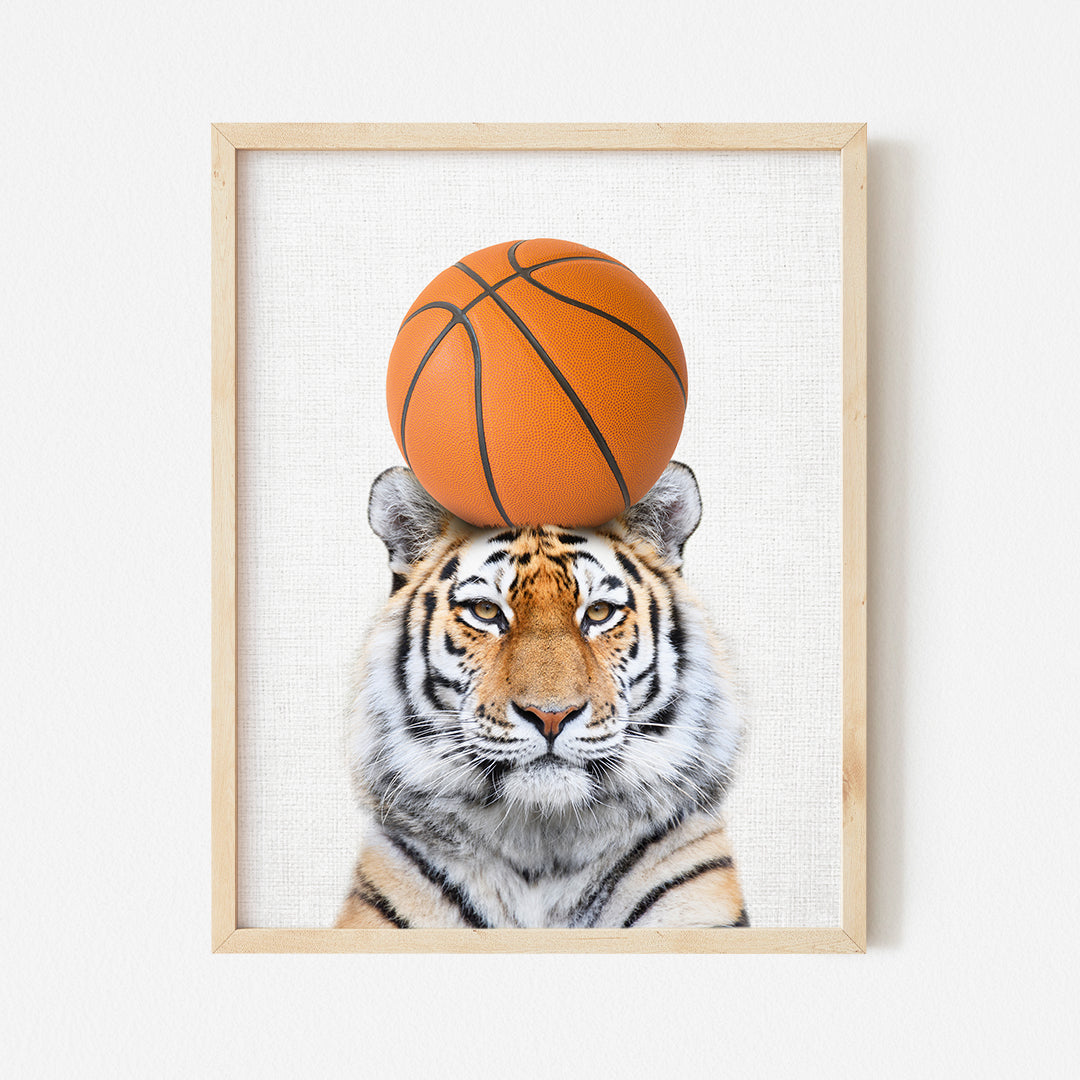 a picture of a tiger with a basketball on its head