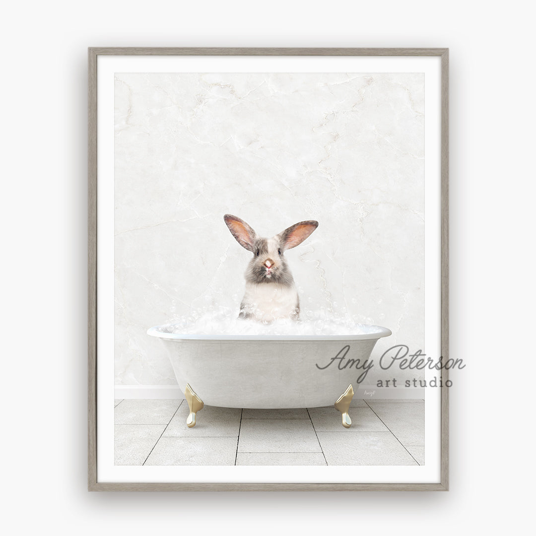 a rabbit sitting in a bathtub with his ears sticking out