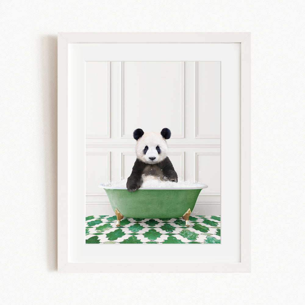 A panda bear sitting in a green bathtub filled with bubbles, surrounded by a green and white patterned rug.