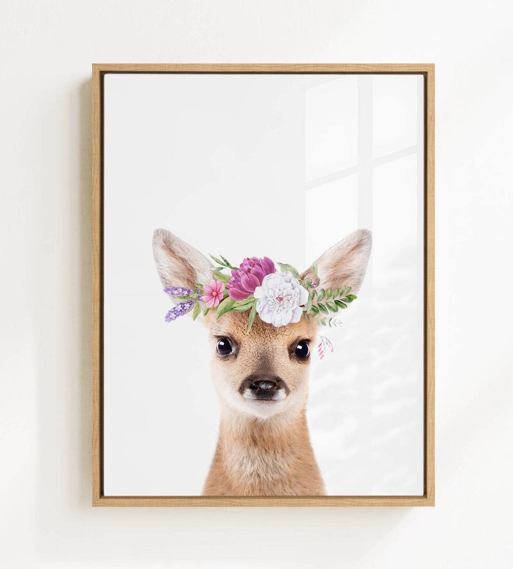A deer wearing a flower crown is the focus of the image.