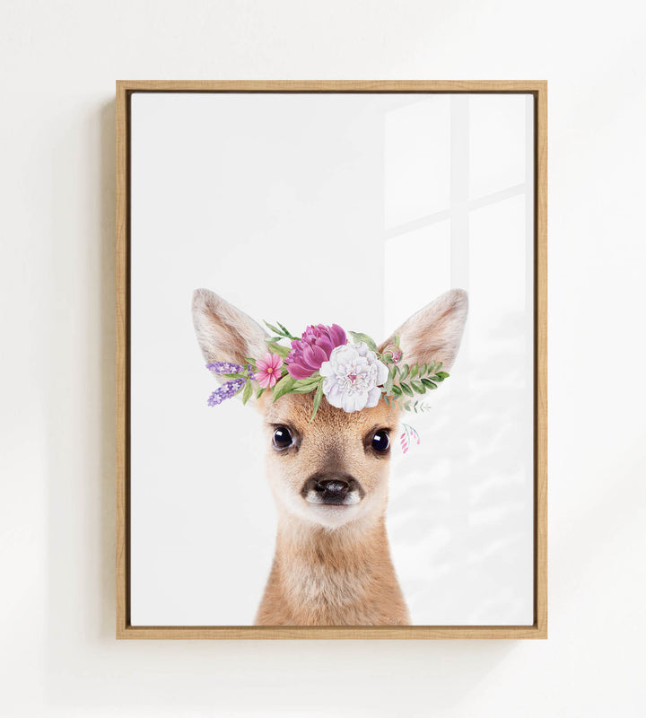A deer wearing a flower crown is the focus of the image.