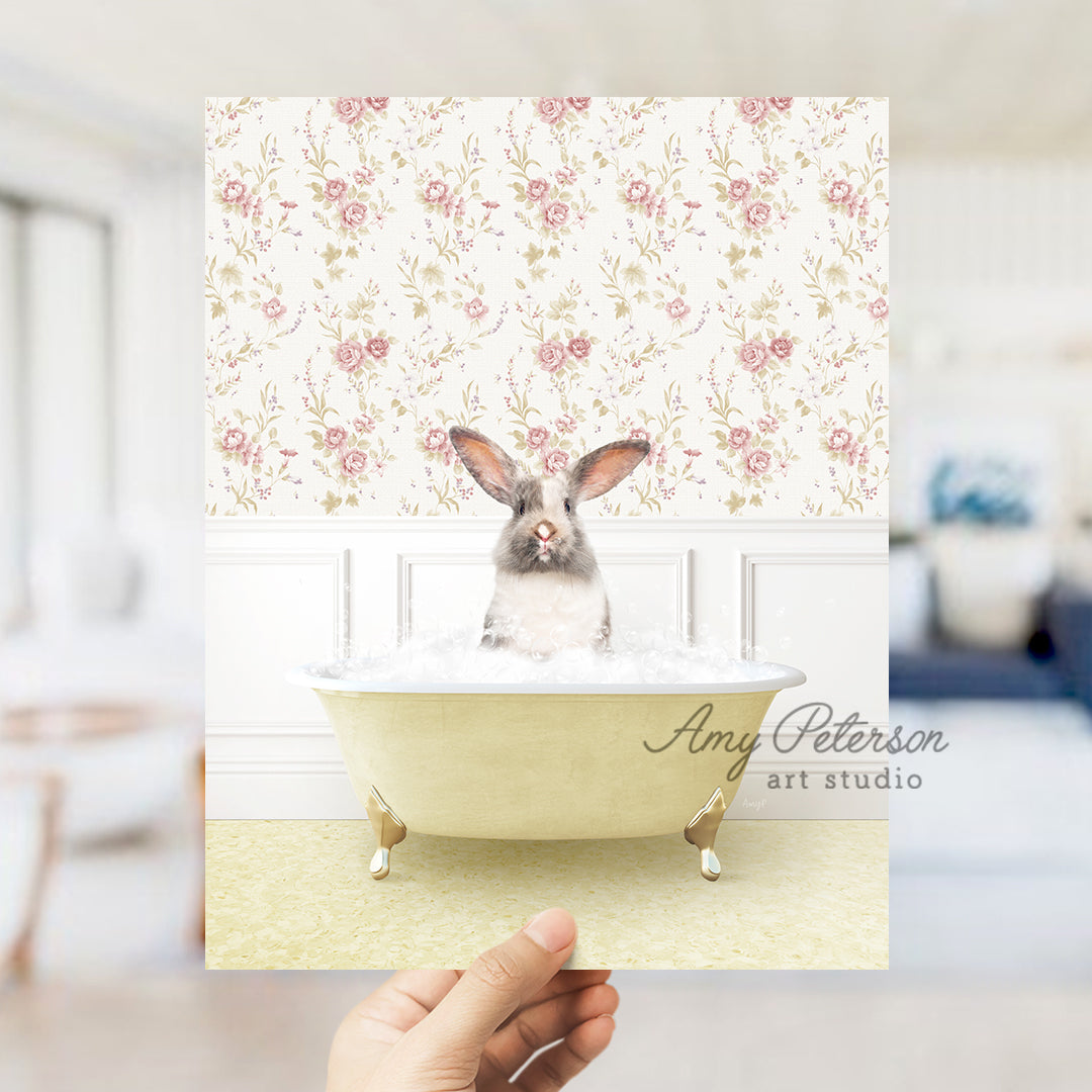 a person holding up a card with a picture of a rabbit in a bathtub