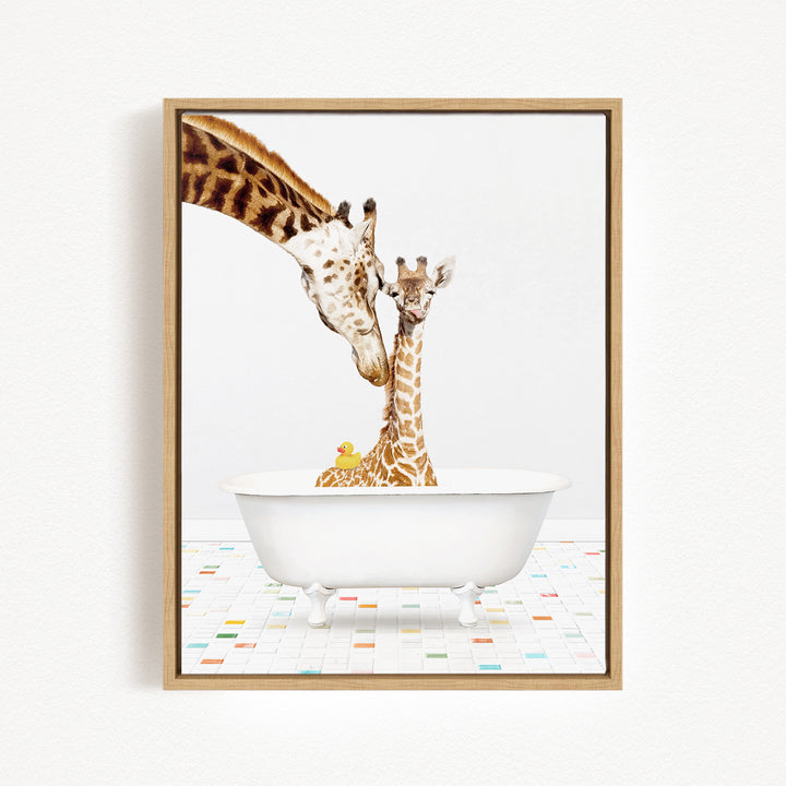 A mother giraffe and her baby giraffe are sitting together in a white bathtub, with a yellow rubber duck floating in the water.
