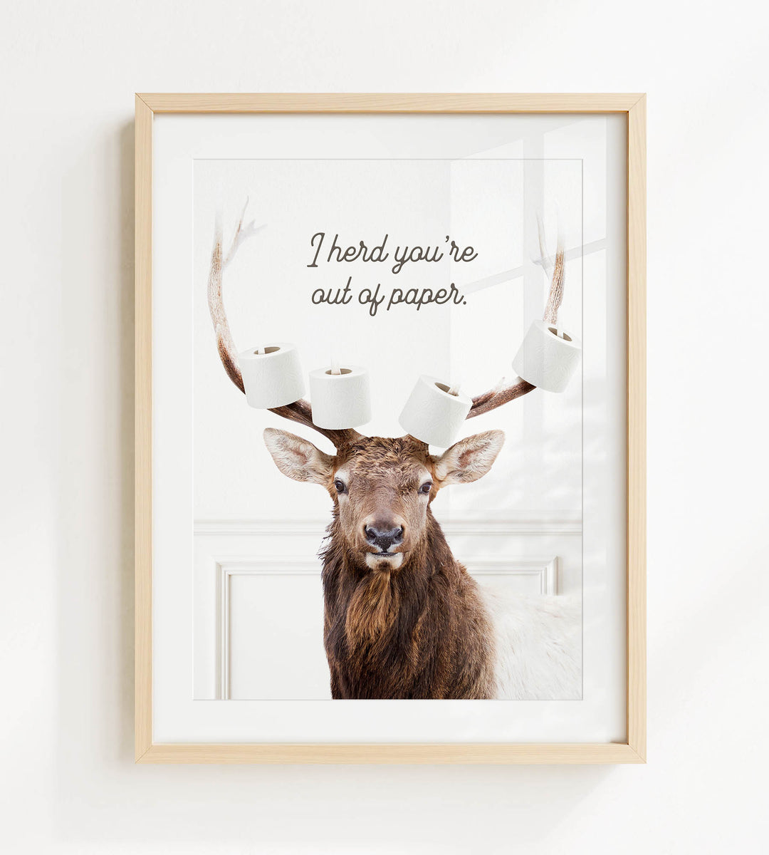 A deer with antlers is depicted in a framed picture, with the text "I herd you're out of paper."