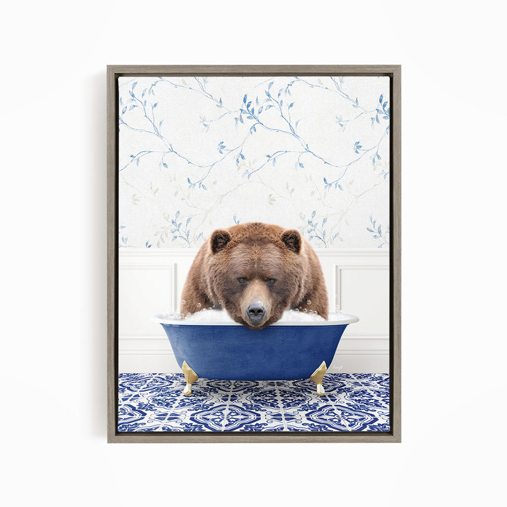 A brown bear is sitting in a blue bathtub, appearing to be enjoying a relaxing bath.