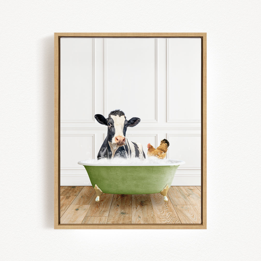 A black and white cow is sitting in a green bathtub, with a chicken standing nearby, in a white-walled room with a wooden floor.