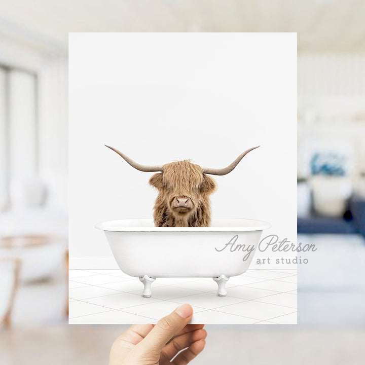 a person holding up a card with a picture of a bull in a bathtub