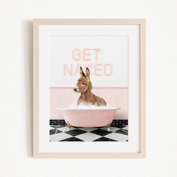 A donkey is sitting in a pink bathtub filled with bubbles, with the text "GET NAUGED" displayed above it.