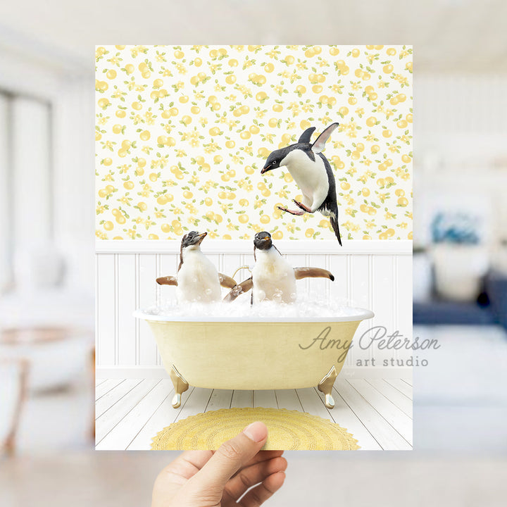 a hand holding up a card with penguins in a bathtub