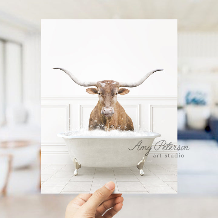 a person holding up a card with a picture of a bull in a bathtub